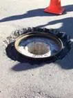 Blowing a pothole clean before repair